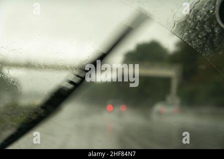 Highway,  rain,  windshield wipers,  taillights Stock Photo