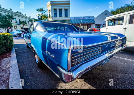 Fernandina Beach, FL - October 18, 2014: Wide angle low perspective rear corner view of a 1966 Pontiac GTO hardtop coupe at a classic car show in Fern Stock Photo