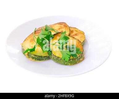 Fried zucchini on a plate isolated on white Stock Photo