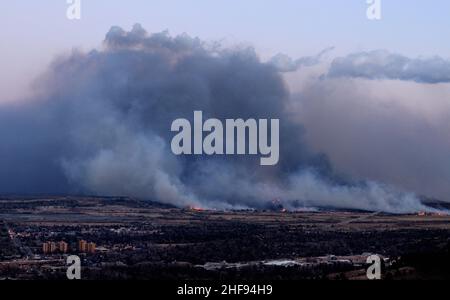 Marshall Fire, Boulder County, CO, rages during late afternoon 12/30/2021. Image made from Flagstaff Mountain. 1,000 homes affected, most destroyed. Stock Photo