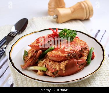 Chilli Mud Crab, Crab with Singaporean Sauce, Special Singapore Cuisine. Served on White Plate Stock Photo