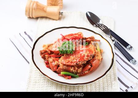 Chilli Mud Crab, Crab with Singaporean Sauce, Special Singapore Cuisine. Served on White Plate Stock Photo