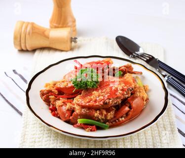 Chilli Mud Crab, Crab with Singaporean Sauce, Special Singapore Cuisine. Served on White Plate Stock Photo