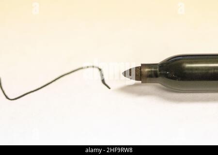 Permanent sharpie Marker close up written black line on white paper . High quality photo Stock Photo