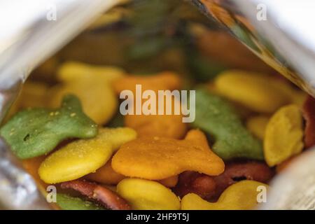 Close up of Gold Fish Crackers multi colored in the bag . High quality photo Stock Photo
