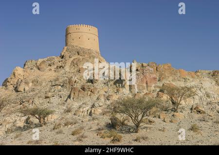 An old watchtower at Hatta in the Emirate of Dubai in the United Arab Emirates. Stock Photo