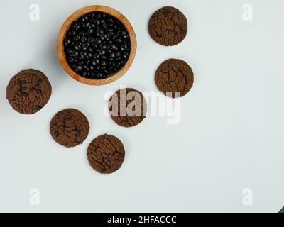 collection of Chocolate chip cookies and chip chocolate in a wooden bowl on white background. Stock Photo