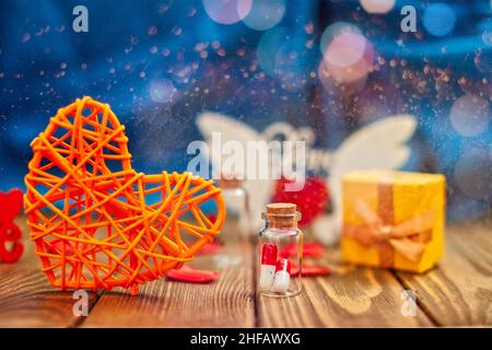 Yellow box with gift and red heart shape on a knitted blanket , I love you .Tablets in jars are kissing, Happy Valentine's Day, Mother's Day, March 8, Stock Photo