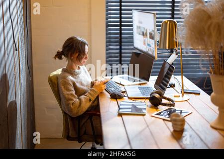 Woman works from cozy home office Stock Photo