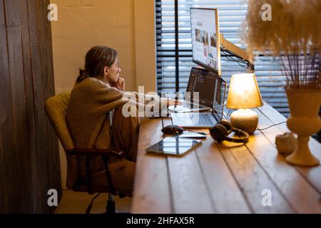 Woman works from cozy home office Stock Photo