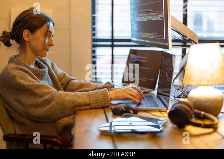 Female programmer works from home Stock Photo