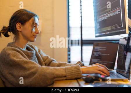 Female programmer works from home Stock Photo