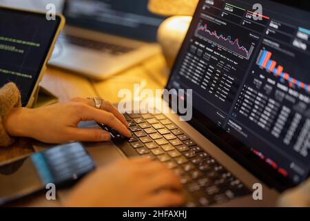 Working on programming dashboard on laptop Stock Photo