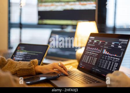 Working on programming dashboard on laptop Stock Photo