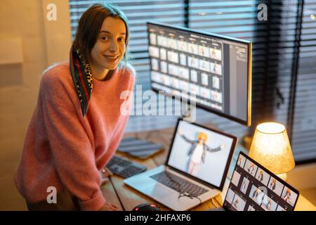 Photographer editing photos at home office Stock Photo