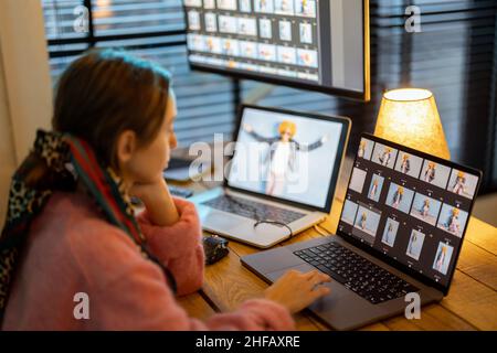 Photographer editing photos at home office Stock Photo