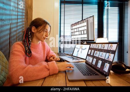Photographer editing photos at home office Stock Photo