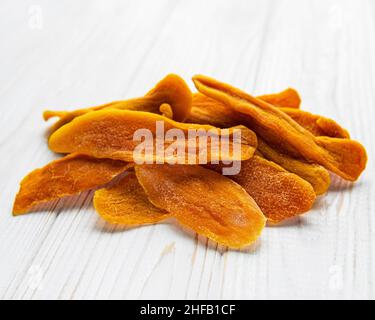 Dried Mango Fruit on Old Wooden Background Stock Photo