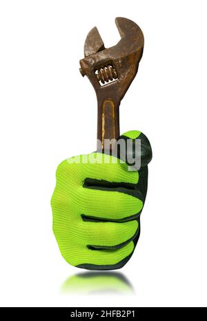 Extreme close-up of a hand with protective work glove, holding an old rusty adjustable wrench. Isolated on white background with reflections. Stock Photo