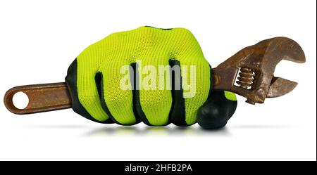 Extreme close-up of a hand with protective work glove, holding an old rusty adjustable wrench. Isolated on white background with reflections. Stock Photo