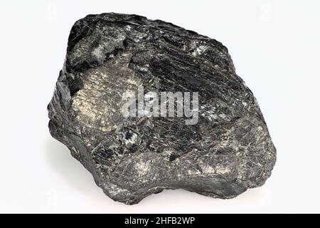 Black piece of coal on a white background close up isolated Stock Photo