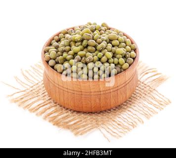 Mung bean, green vigna radiata in wooden bowl isolated on white background Stock Photo