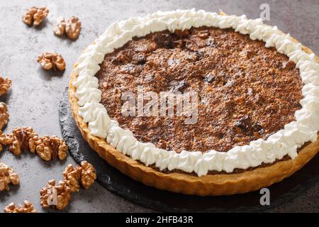 Kentucky Chocolate Walnut Pie for a Derby Day treat closeup on the concrete table. Horizontal Stock Photo