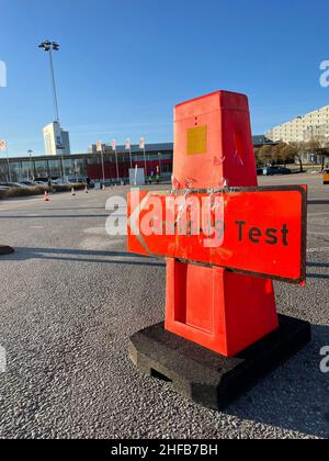 Directional sign at parking lot and drive-in to take a covid-19 test where tests for coronavirus are distributed in Stockholm, Sweden Stock Photo