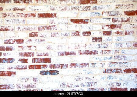 old red brick wall over painted by white Stock Photo
