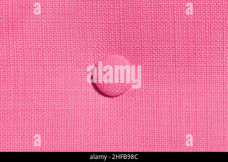 Home upholstered furniture concept. Pink fabric background. Three round ornament detail. Home comfort. Stock Photo