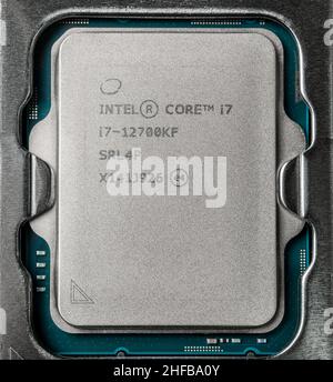 Moscow, Russia - January 12, 2022: Latest Intel i7 12700kf processor chip in socket on motherboard. Intel is one of the worlds largest semiconductor c Stock Photo