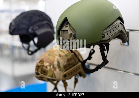 Green, khaki military helmet, isolated white background. Stock Photo