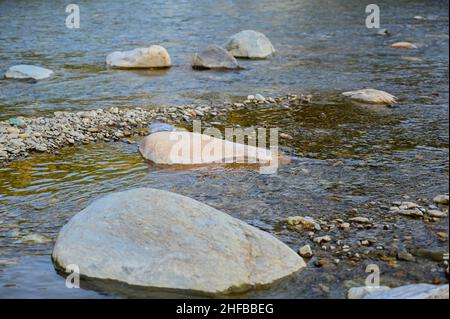 stones in the river water . Stock Photo