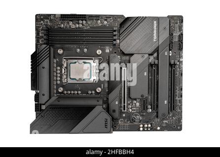 Moscow, Russia - January 12, 2022: Latest Intel i7 12700kf processor chip in socket on motherboard. Intel is one of the worlds largest semiconductor c Stock Photo