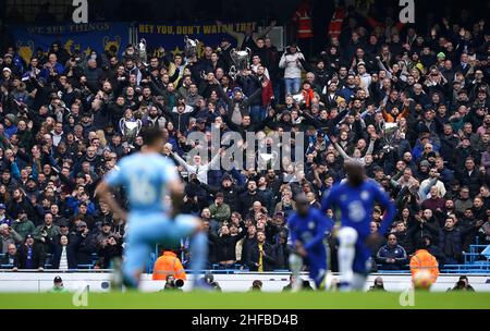 Chelsea fans hold up inflatable European Cup trophies in the safe standing section of the stands before the Premier League match at Etihad Stadium, Manchester. Picture date: Saturday January 15, 2022. Stock Photo