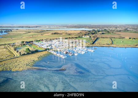 Thornham Marina situated in the Prinstead Estuary Channel on the Southern Coast of England, aerial photo. Stock Photo