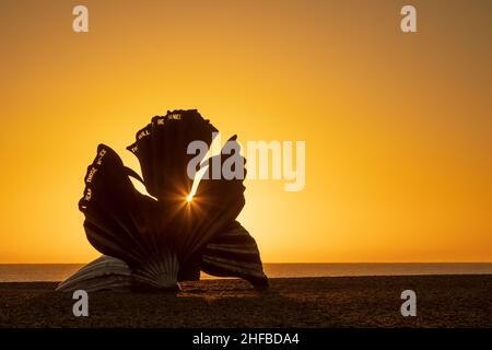 Sunrise at the Scallop sculpture on the beach in Aldeburgh. UK. Stock Photo