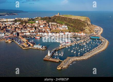 Aerial Image of Scarborough on New Years Day just before Sunset at High Tide. 1st January 2022 Stock Photo