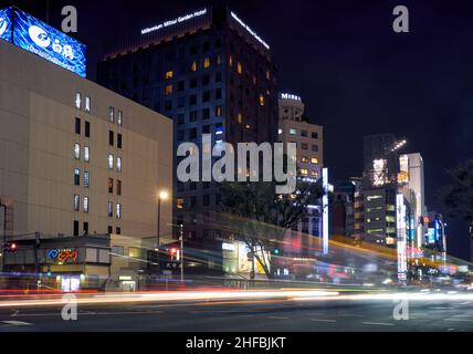 Tokyo, Japan - October 24, 2019: The  view of one of the main shopping street of Ginza district, the Harumi dori avenue at the bright night lighting. Stock Photo