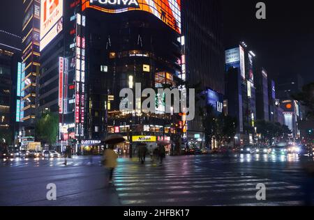 Tokyo, Japan - October 24, 2019: The view of the brightly lighted night street in the Ginza district at the center of Tokyo. Japan Stock Photo