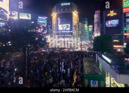 Tokyo, Japan - October 25, 2019:  The night view of one of the busiest crossing in the world, Shibuya Crossing or Shibuya Scramble Crossing in front o Stock Photo