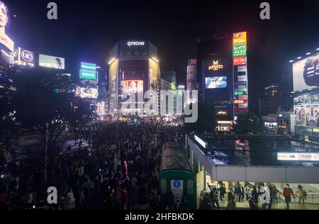 Tokyo, Japan - October 25, 2019:  The night view of one of the busiest crossing in the world, Shibuya Crossing or Shibuya Scramble Crossing in front o Stock Photo