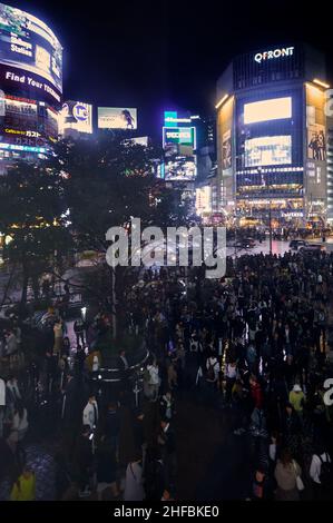 Tokyo, Japan - October 25, 2019:  The night view of one of the busiest crossing in the world, Shibuya Crossing or Shibuya Scramble Crossing in front o Stock Photo