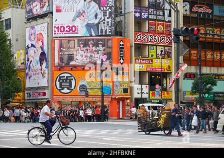 Tokyo, Japan - October 26, 2019:  The view of Akihabara crossroads surrounded by the many manga, anime and electronic shops icons. Chiyoda ward. Tokyo Stock Photo