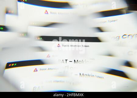 Milan, Italy - January 11, 2022: basic attention token - BAT logo on laptop screen seen through an optical prism. Dynamic and unique image form basic Stock Photo