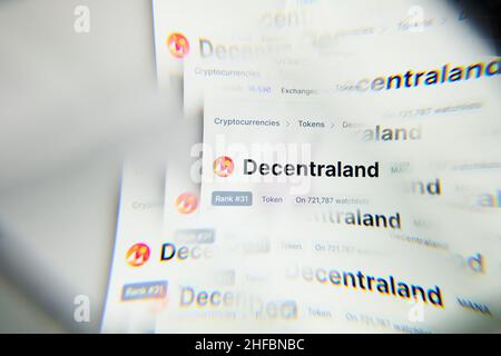 Milan, Italy - January 11, 2022: decentraland - MANA logo on laptop screen seen through an optical prism. Dynamic and unique image form decentraland, Stock Photo