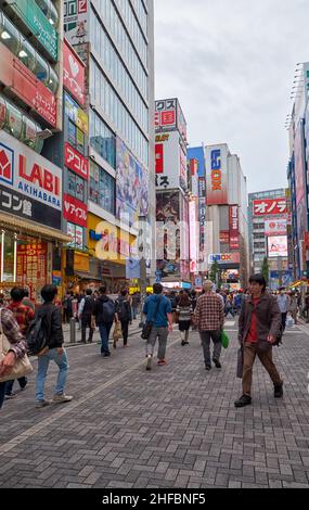 Tokyo, Japan - October 26, 2019: The view of Akihabara buzy street surrounded by the many manga, anime and electronic shops icons. Chiyoda ward. Tokyo Stock Photo