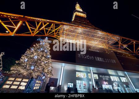 Tokyo, Japan – November 13, 2007: The look up at the brightly illuminated Eiffel-like lattice Tokyo Radio Tower with Christmas decorations at night. S Stock Photo