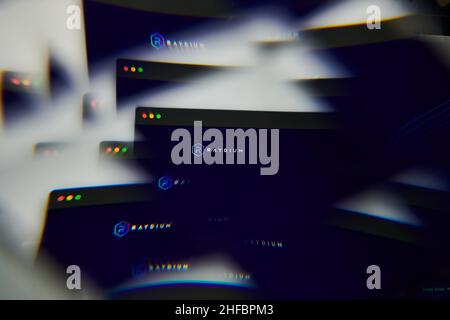 Milan, Italy - January 11, 2022: raydium - RAY logo on laptop screen seen through an optical prism. Dynamic and unique image form raydium, RAY coin we Stock Photo