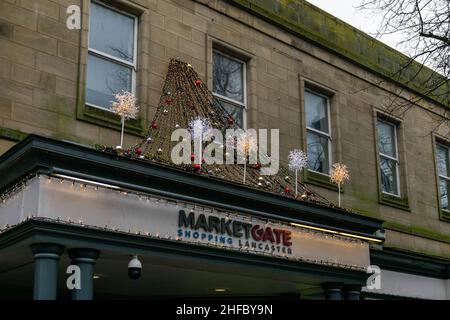 Lancaster, UK - 4th January 2020 - MarketGate Shopping Centre in city centre Lancaster, Lancashire with festive Christmas decorations welcoming shops Stock Photo